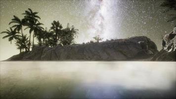 Beautiful fantasy tropical beach with Milky Way star in night skies video