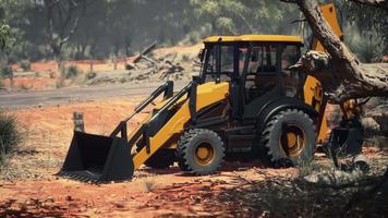 excavator tractor in bush forest video