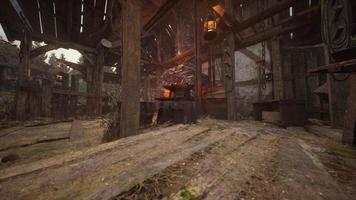 old abandoned blacksmiths workshop with rusted anvil hammer and tools