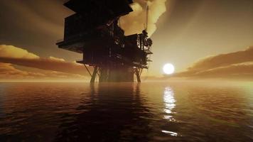 Aerial view offshore drilling rig at the offshore location during sunset video