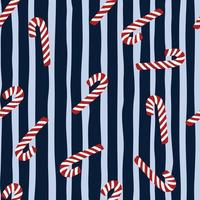 Seamless random pattern with red and white colored christmas lollipops. Navy blue striped background. New year design. vector