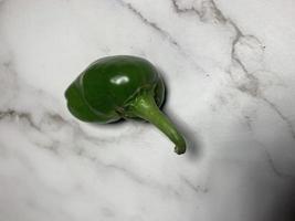 Green chili pepper or Hatch Double-X Hot chile. Numex or New Mexican pod type. Top view photo