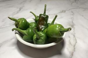 Green chili pepper or Hatch Double-X Hot chile. Numex or New Mexican pod type. Top view photo
