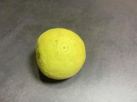 Ripe Yellow Lemons Close-up Background Or Texture. Lemon Harvest, Many Yellow Lemons. photo