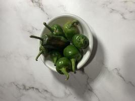 Green chili pepper or Hatch Double-X Hot chile. Numex or New Mexican pod type. Top view photo