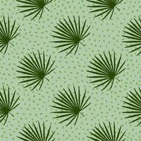 Diagonal ornament tropic seamless pattern with hand drawn fan palm shapes. Light green background with dots. vector