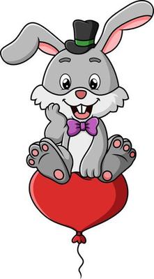The happy rabbit is sitting on the flying love balloon