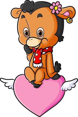 The cute happy sheep is sitting on the flying heart