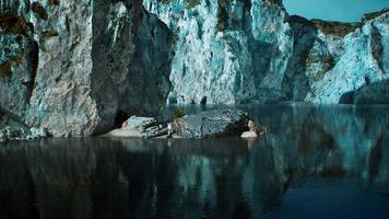 rocky cliffs in the ocean at sunny day video