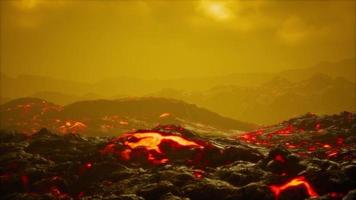 black lava field with hot red orangelavaflow at sunset video