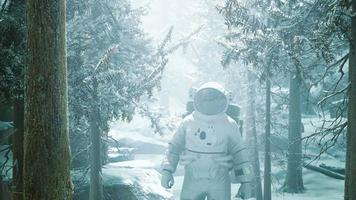 Astronaut exploring forest in snow video