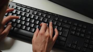 Hands of the woman typing on the computer. video