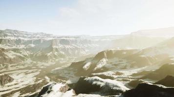 snowy mountains with deep ravine and rock cliffs video
