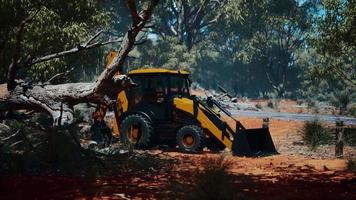 excavator tractor in bush forest video