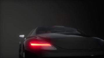 luxury sport car in dark studio with bright lights video