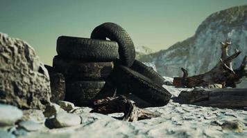 Old car tires on the beach video