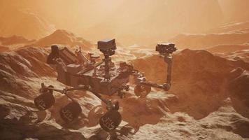 Curiosity Mars Rover exploring the surface of red planet. Elements of this image furnished by NASA video