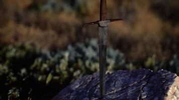 famous sword excalibur of King Arthur in the rock video