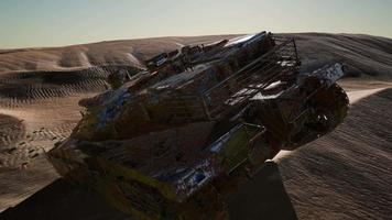 Militairy tanks destructed in the desert at sunset video