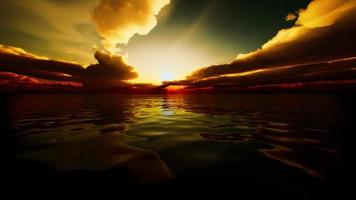 twilight sky in colorful bright sunlight reflects off on the water surface video