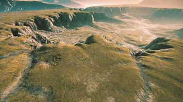 Landscape with mountains and dry yellow grass in New Zealand photo