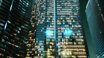 Night architecture of skyscrapers with glass facade photo