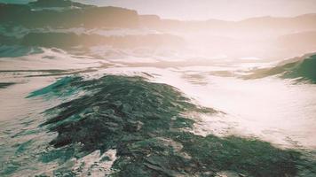 rocks and hills under the snow photo