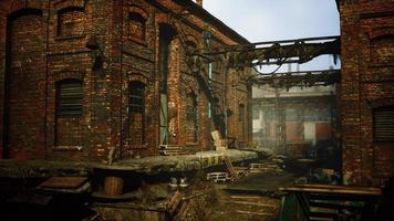 abandoned industrial factory buildings at sunset photo