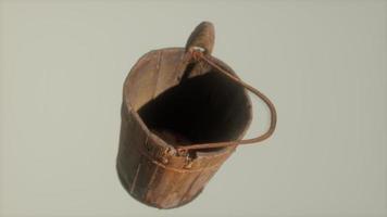 Old used rusted wooden bucket photo