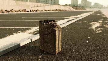 old metal fuel canister on beach parking photo