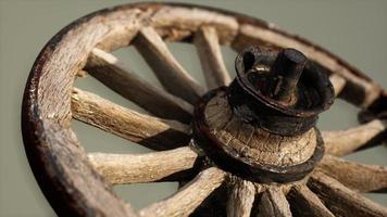 Handmade rustic vintage wooden wheel used in medieval wagons photo