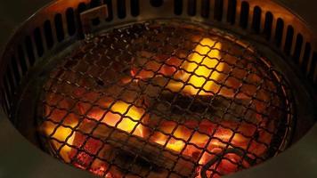 Fire in BBQ Charcoal grill stove for grilling food with smoke hood. video