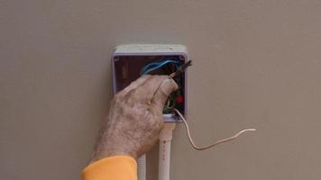 Electrical plug repairs and extension cords by a professional electrician. video