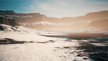 rocks and hills under the snow photo