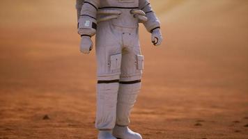 Astronaut on Mars Surface. Red Planet Covered in Gas and rock photo