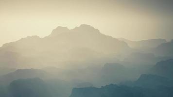 Fog in rocky mountain valley photo