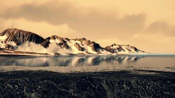 coastline of Antarctica with stones and ice photo