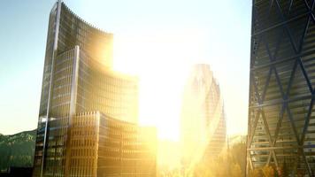 city skyscrapes with lense flairs at sunset photo