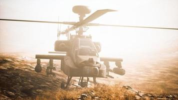 military helicopter in mountains at war photo