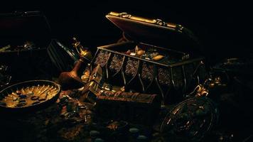 treasures in a dark cave with coins diamonds and gold photo