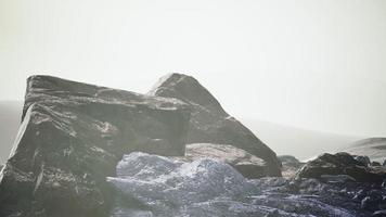 snow ice and rocks at northern landscape photo