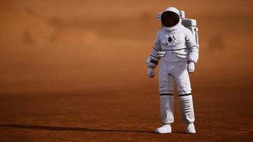 Astronaut on Mars Surface. Red Planet Covered in Gas and rock photo