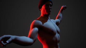 Handsome muscular shirtless young man standing in the dark photo