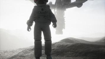 Astronaut walking on an Mars planet photo