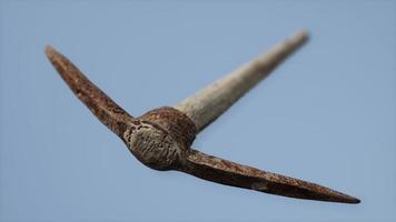 Close up of an old rusted pickaxe head photo