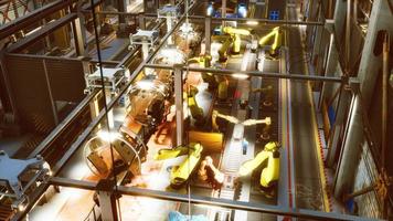 robotic arms in a car factory photo