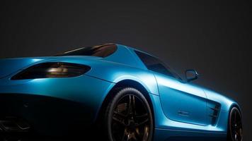 luxury sport car in dark studio with bright lights photo