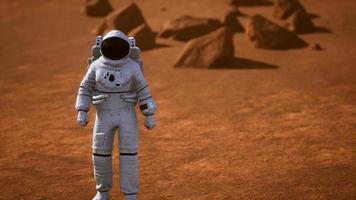 Astronaut on Mars Surface. Red Planet Covered in Gas and rock photo