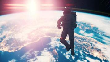 Space man astronaut in space on a background of the blue planet Earth photo