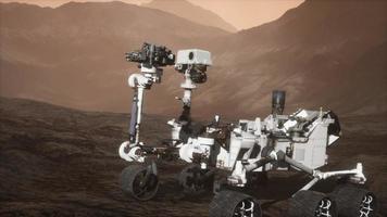 Curiosity Mars Rover exploring the surface of red planet. Elements of this image furnished by NASA photo